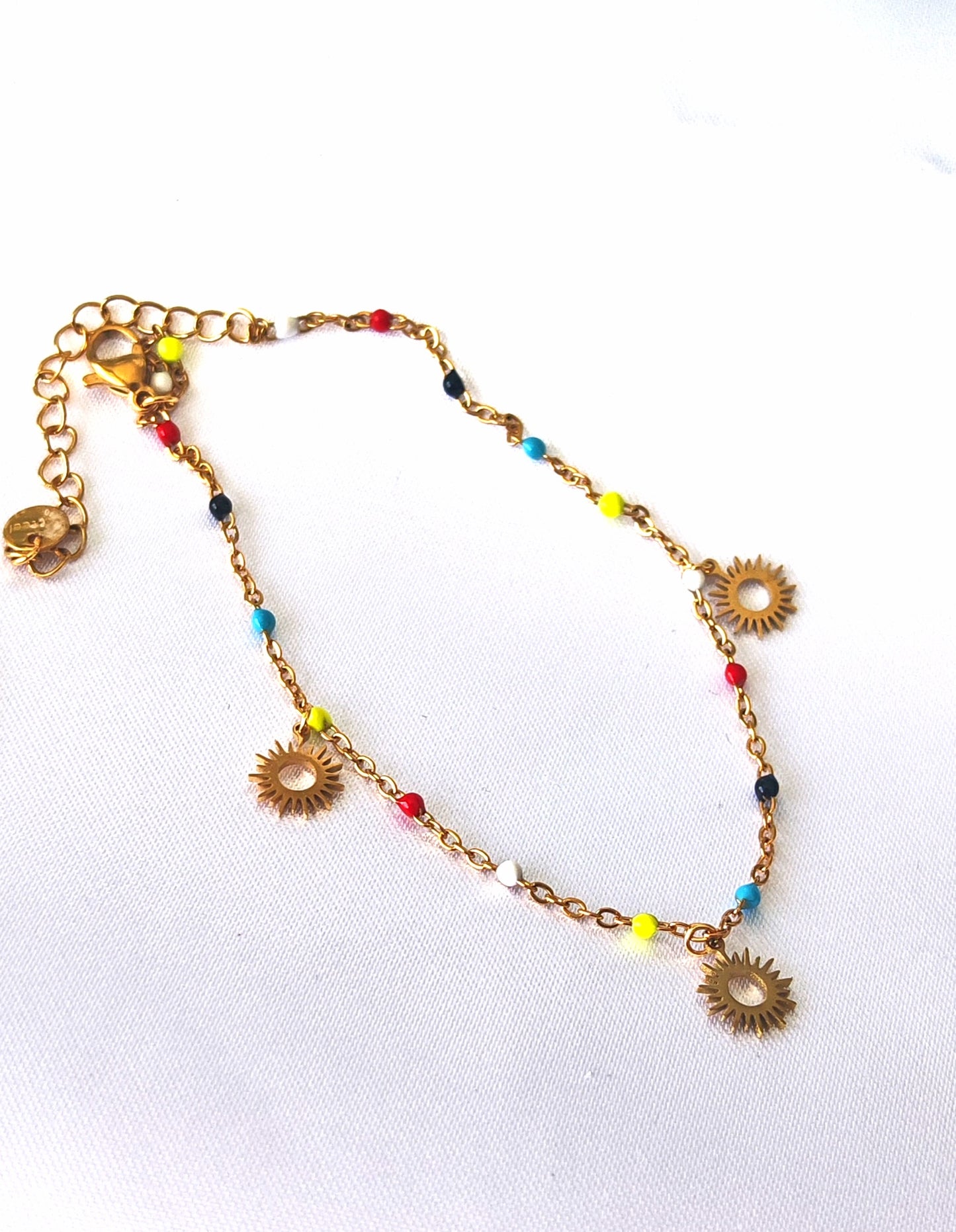 Bracelet de cheville acier inoxydable Sunny - acier inoxydable Fabriqué en acier inoxydable de qualité supérieure, ce bracelet de cheville coloré comporte des pampilles soleil Léger et durable, il ajoutera une touche élégante et féminine à toute tenue. Parfait pour les occasions spéciales ou pour le quotidien.